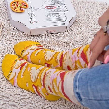 person wearing pineapple pizza socks 