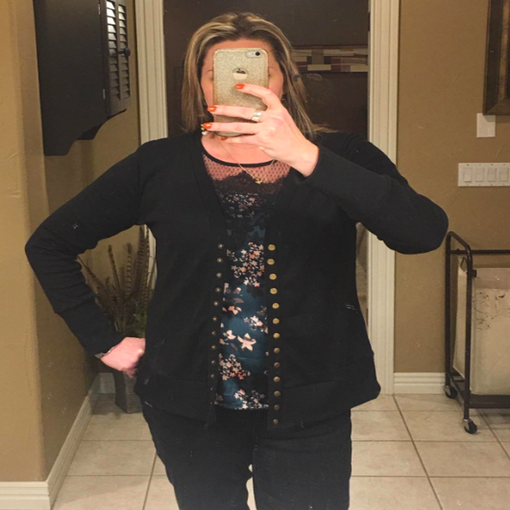reviewer wearing the black cardigan 