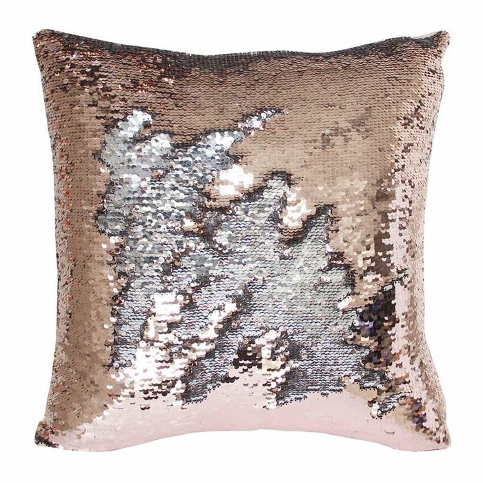 The gold pillow with a patch of sequins flipped to turn silver