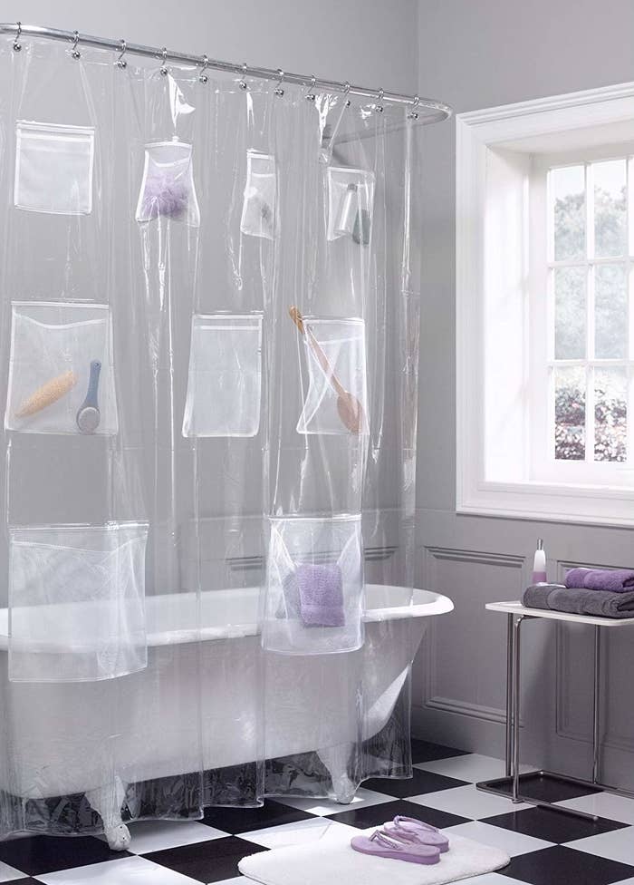The curtain with brushes, towels, tubes, and more inside its pockets