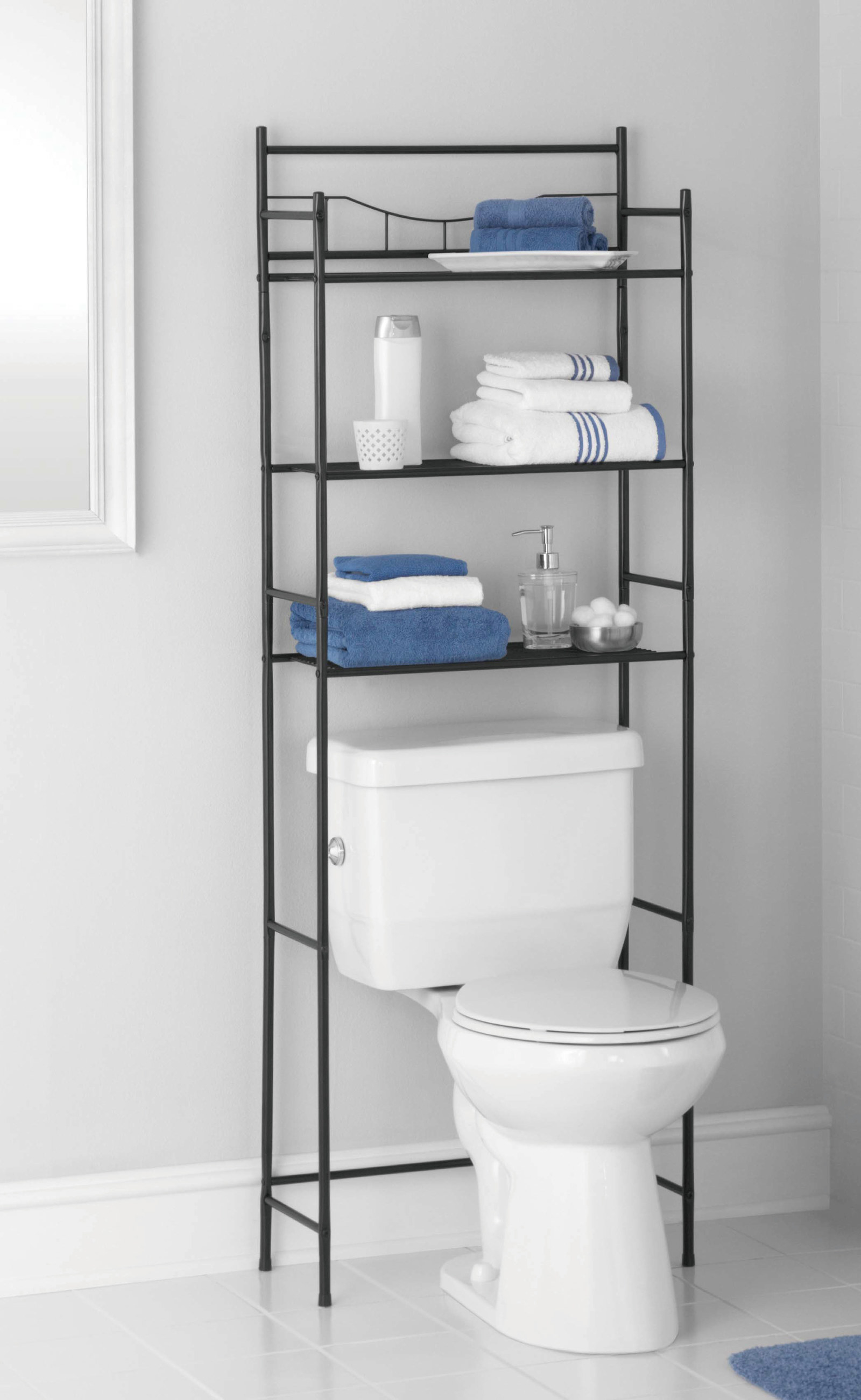 The shelf  holding various items over the toilet