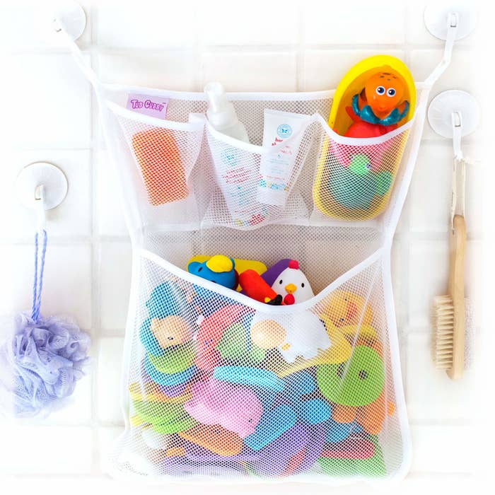 a mesh net with multiple pockets for organizing bath toys