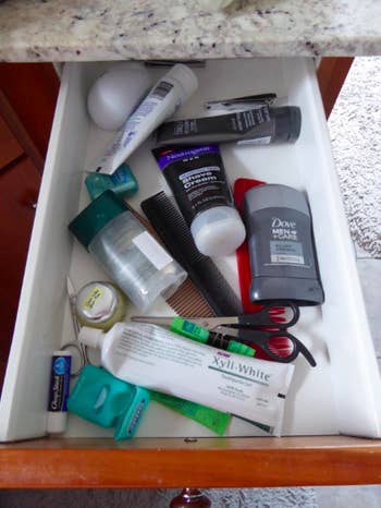 Messy drawer with toiletries