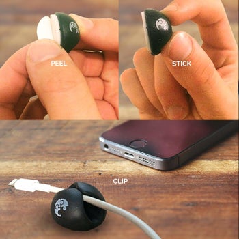 A hand removing the backing on the thumbnail-sized, round cable holder with text 
