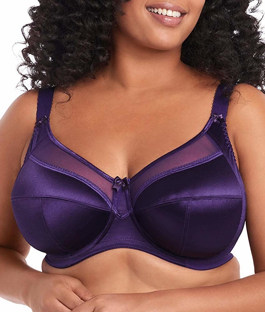 Model wearing purple underwire bra with wide straps, mesh at the top, and a tiny bow