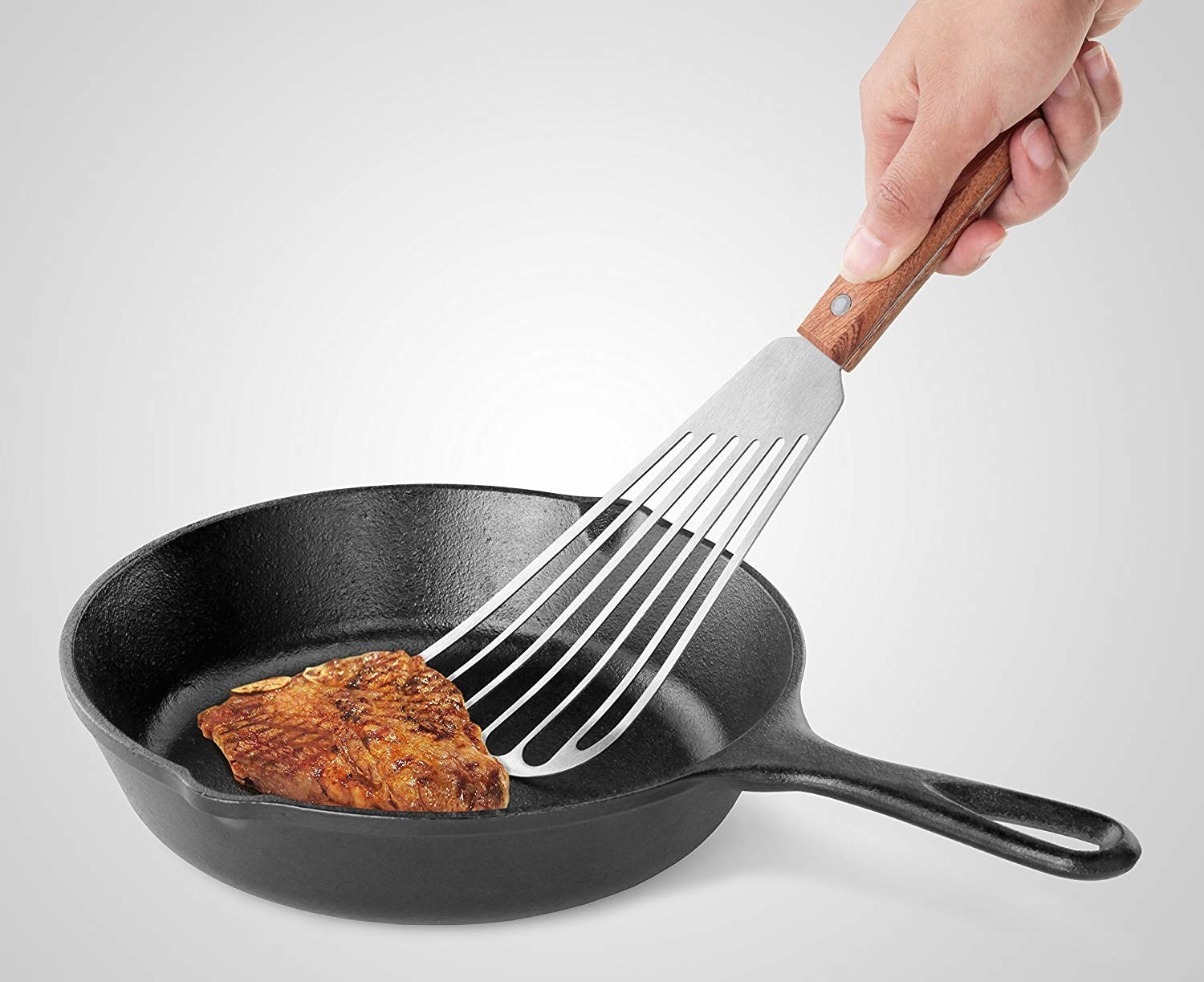The spatula with a long head for flipping fish