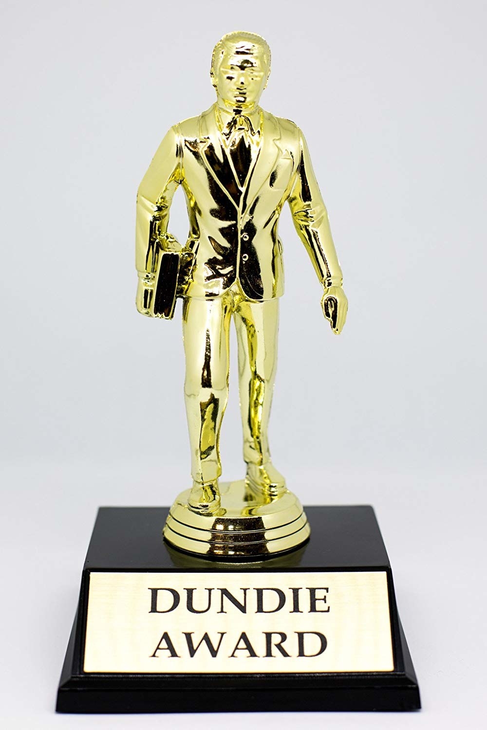 The golden Dundie trophy with the text &quot;DUNDIE AWARD&quot; on the base