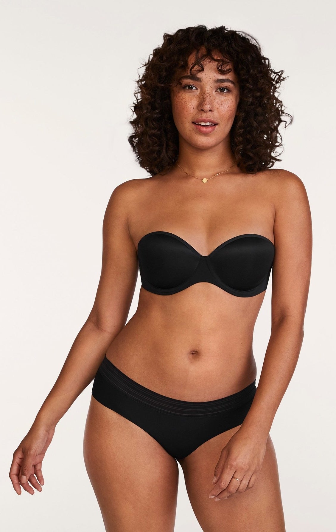 Model in black bra and panties