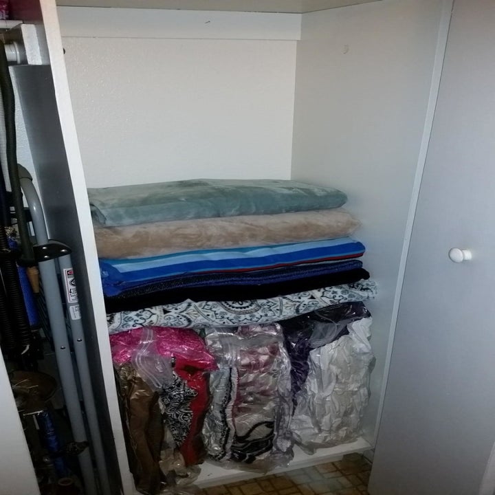 the same closet with more space because it was organized with vacuum storage bags