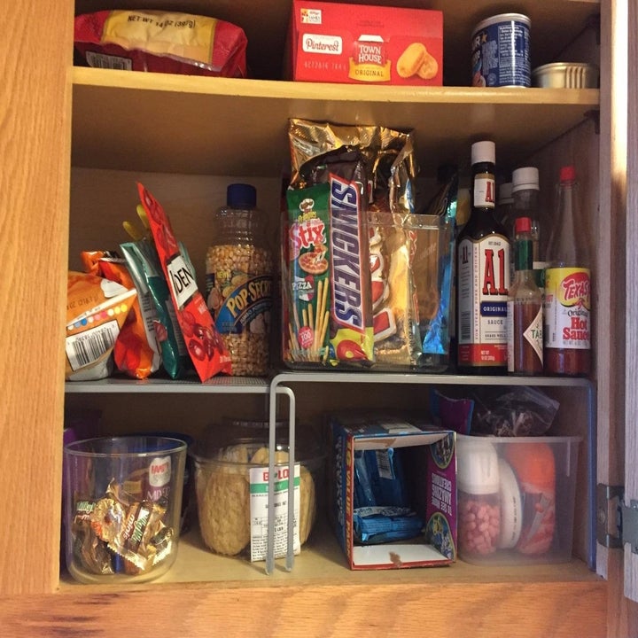 the same kitchen cabinet organized with expandable shelves