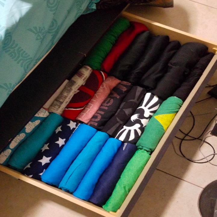 Drawer full of folded shirts 