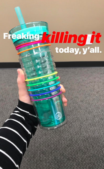 A customer review photo of them holding the bottle with the text, &quot;Freaking killing it today, y&#x27;all.&quot;