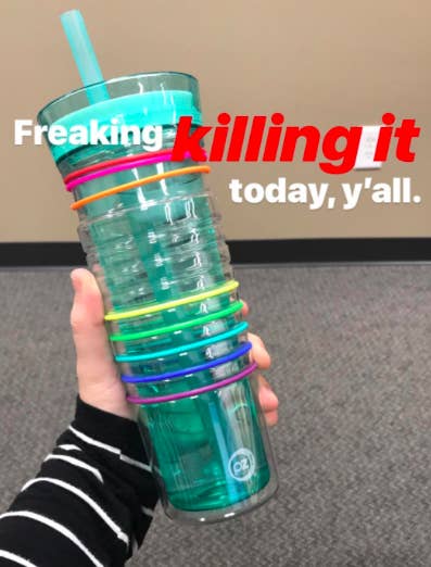 A customer review photo of them holding the bottle with the text, &quot;Freaking killing it today, y&#x27;all.&quot;