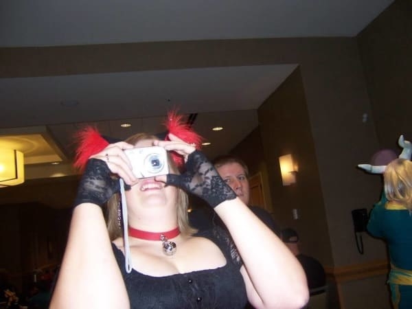 Woman taking a picture on a digital camera