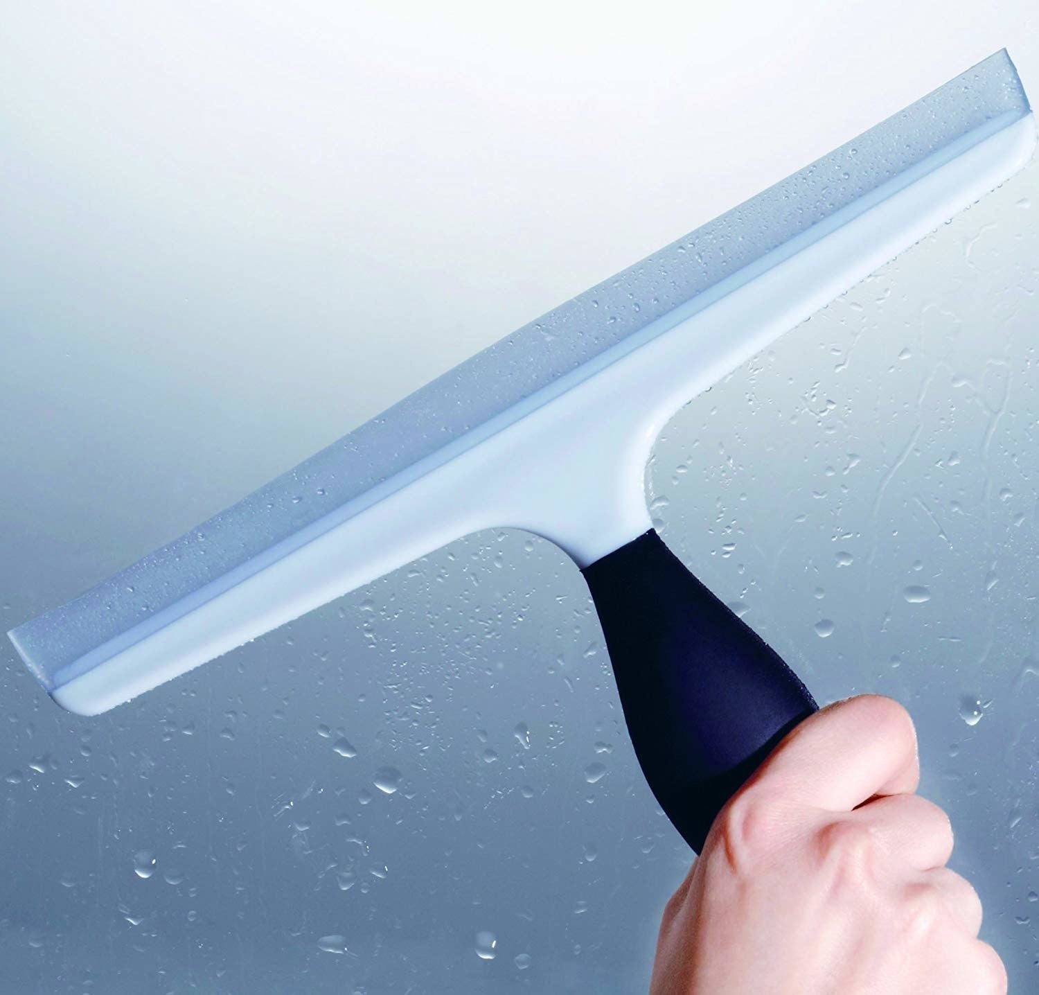 hand holding squeegee 
