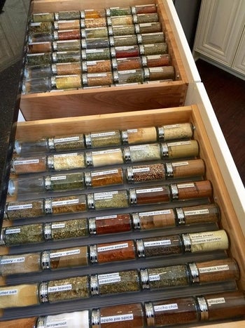 A reviewer's drawer full of spices organized like a grocery aisle