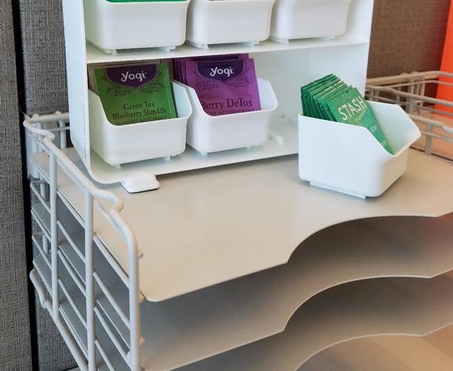 Reviewer photo of the white drawer set with each compartment holding packages of tea
