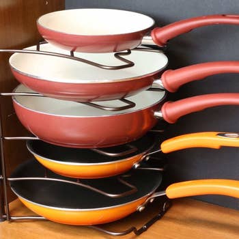 Five pans sitting upright in the organizer