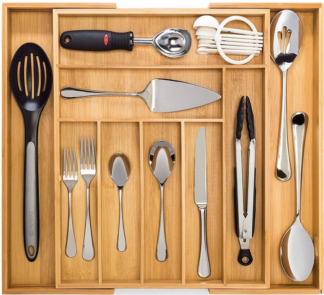 The organizer holding cutlery and other cooking utensils