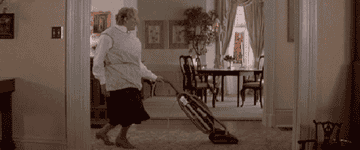 Robin Williams in Mrs. Doubtfire vacuuming and dancing