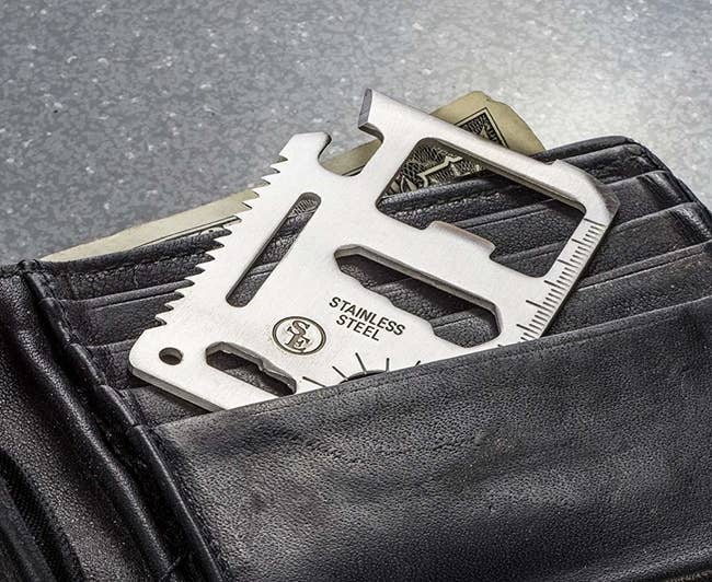 The tool sliding into a wallet pocket