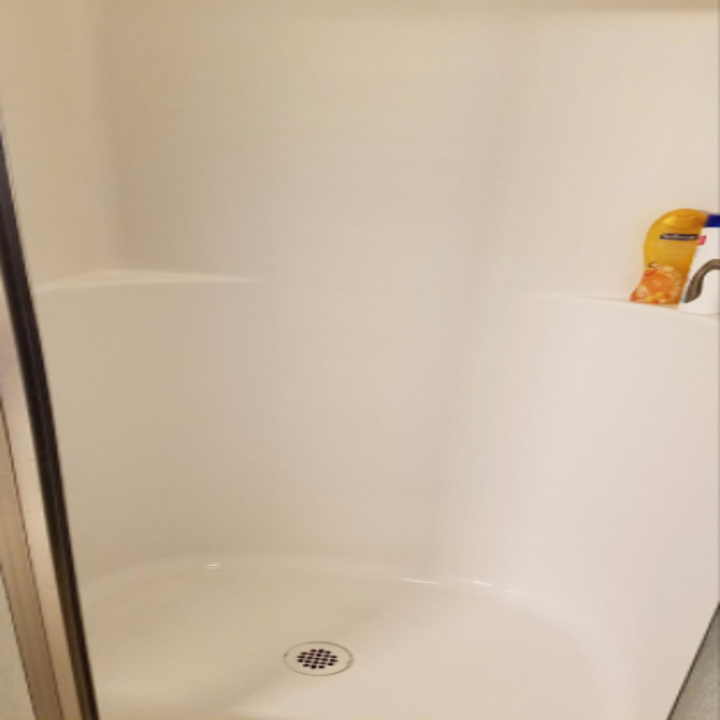 reviewer photo of same shower with less rust 