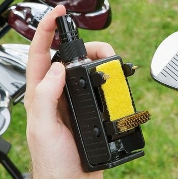 The tool, which looks like a mini spray bottle with brushes and sponges attached to the side