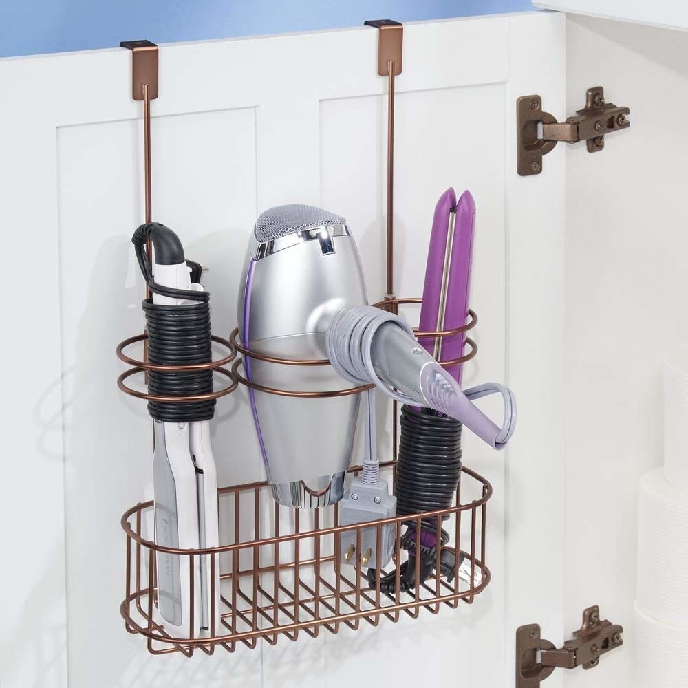 copper wire cabinet rack with secure storage for a hairdryer and tow other tools 