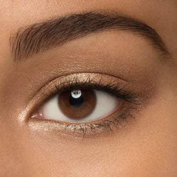 model with the champagne eyeshadow on lid and below eye