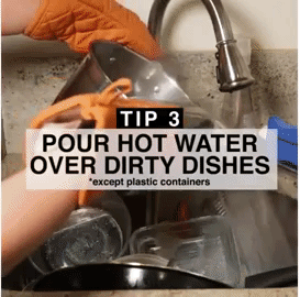 someone pouring hot water over dishes in their sink