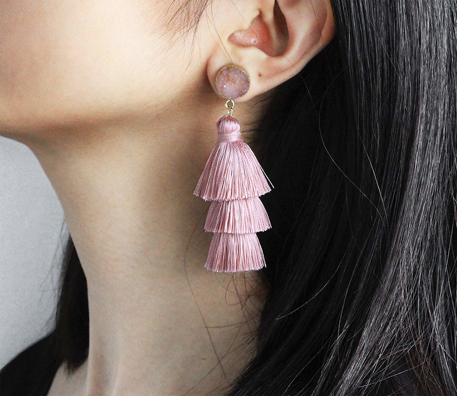 model wearing pink druzy tassel earrings