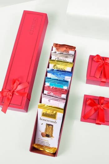 Several sample size chocolates inside a rectangular box with a bow