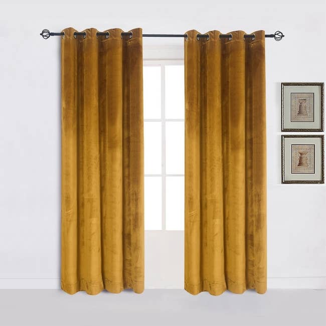 The velvet curtains in a mustard yellow color