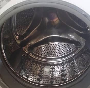inside of a gleaming clean washing machine
