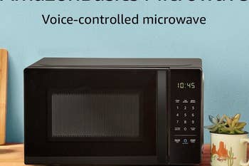 black microwave on kitchen counter