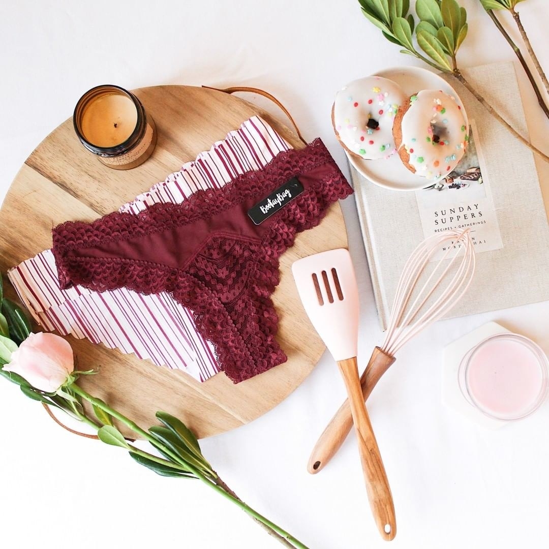 red lacy underwear and striped hipster underwear