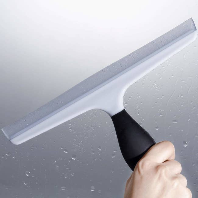 a person holding the squeegee