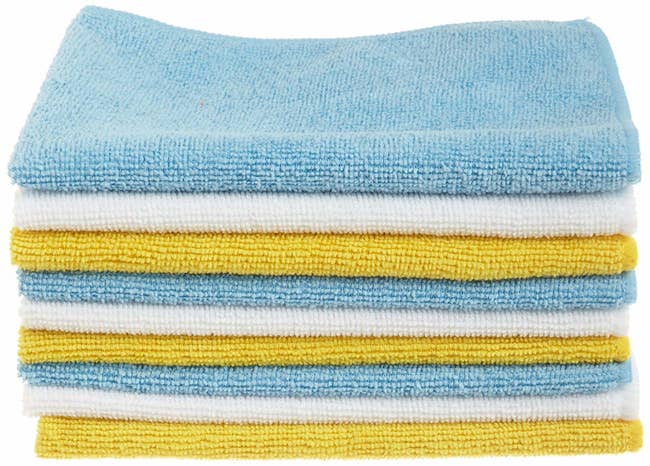 a stack of yellow, blue, and white towels