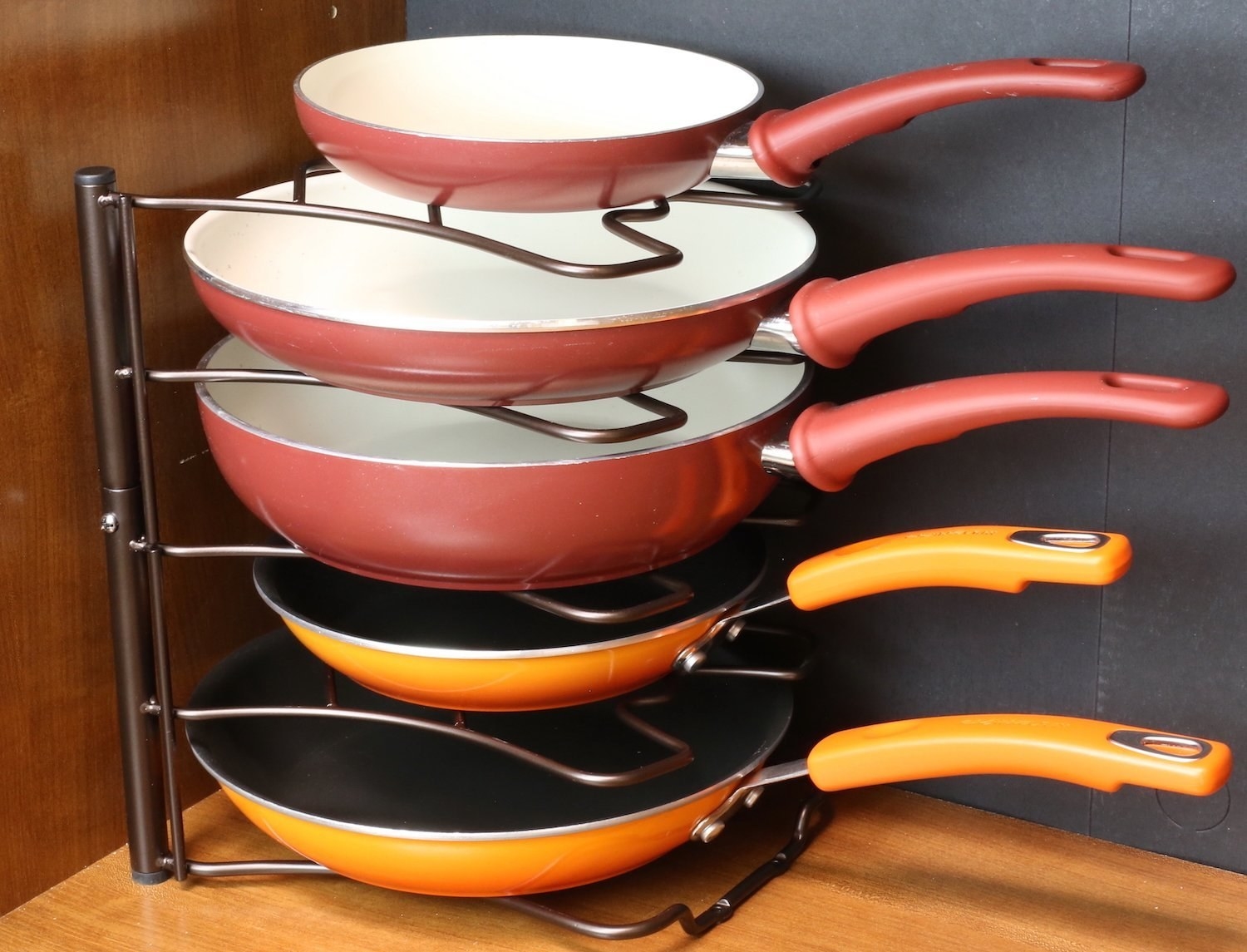 Pans stacked on stainless steel storage system