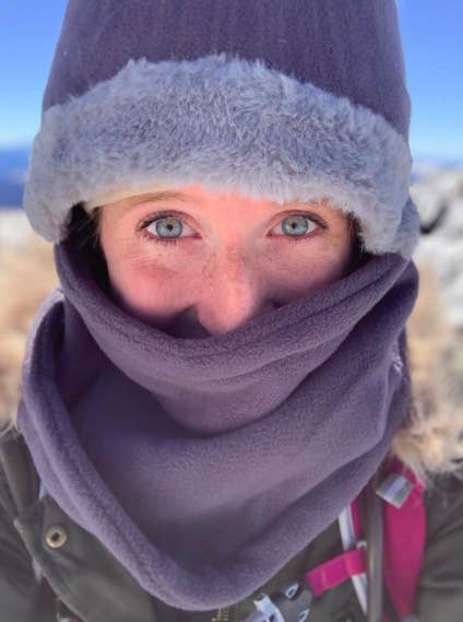 a reviewer wearing the balaclava in purple 