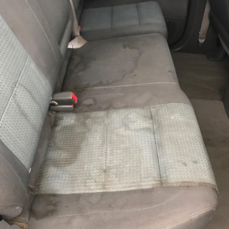 a reviewers' stained back seat of their car