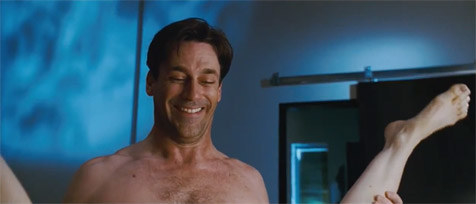 Jon Hamm from Bridesmaids smiling between a woman&#x27;s raised legs