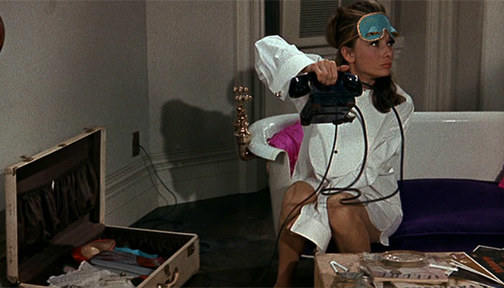 Audrey Hepburn from Breakfast at Tiffany&#x27;s holding a phone