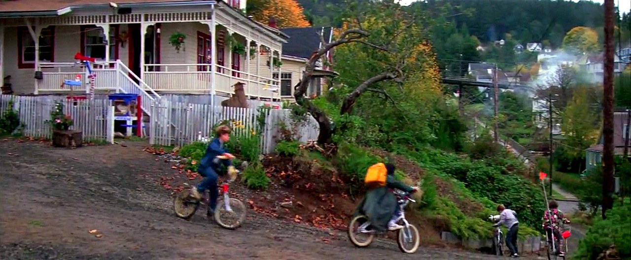 Boys riding their bikes in a scene from the Goonies