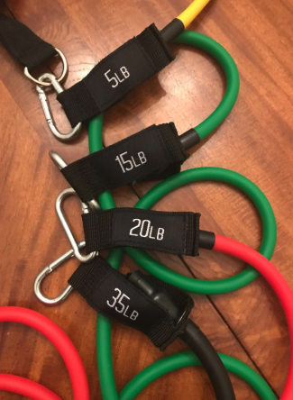 a reviewer's photo of the red and green resistance bands