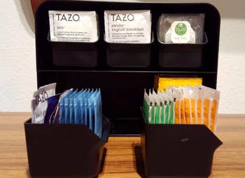 The tea organizer with the drawers pulled our showing how many bags it can fit