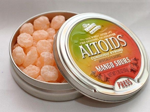 A tin of Mango Sours Altoids opened 