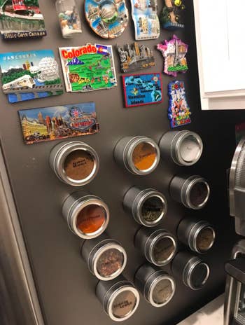 A customer review photo of the magnetic spice containers on their fridge
