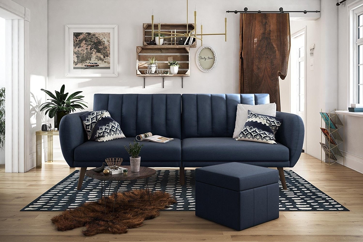 navy blue tufted futon that looks like a couch in a living room