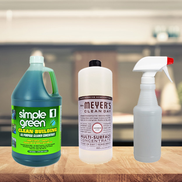 simple green gallon, mrs meyers refill bottle, and spray bottle sitting on kitchen cabinet